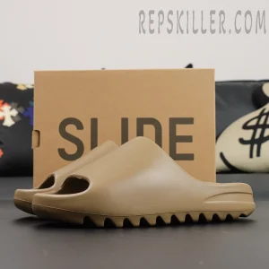 Yeezy Slides ‘Ochre’ with original box background showing ‘SLIDE’ branding
