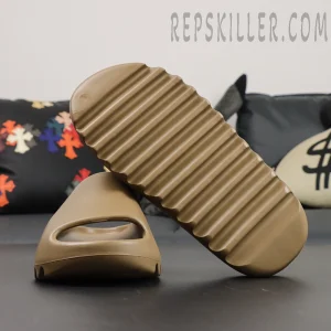 Yeezy Slides ‘Ochre’ sole view highlighting ridged outsole traction pattern