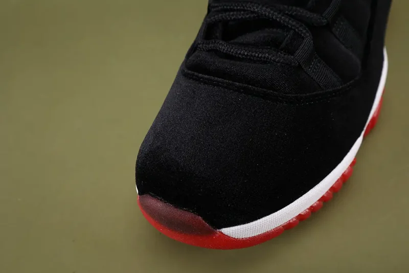 the toe box of the left side of Wmns Air Jordan 11 Retro 'Bred Velvet'