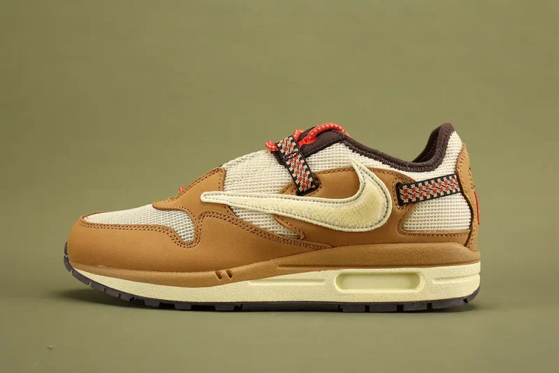 the yellow swoosh of Air Max 1 Travis Scott Cactus Jack Wheat Lemon Drop DO9392-701