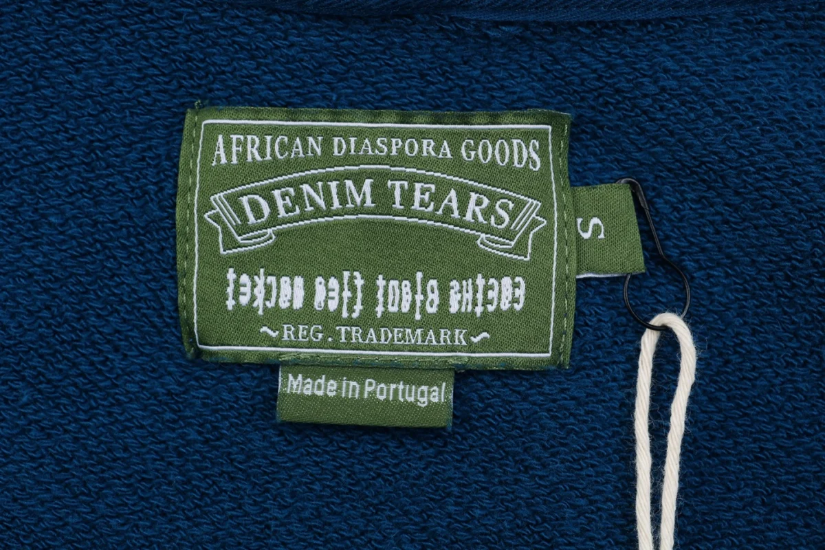 Denim Tears logo tag