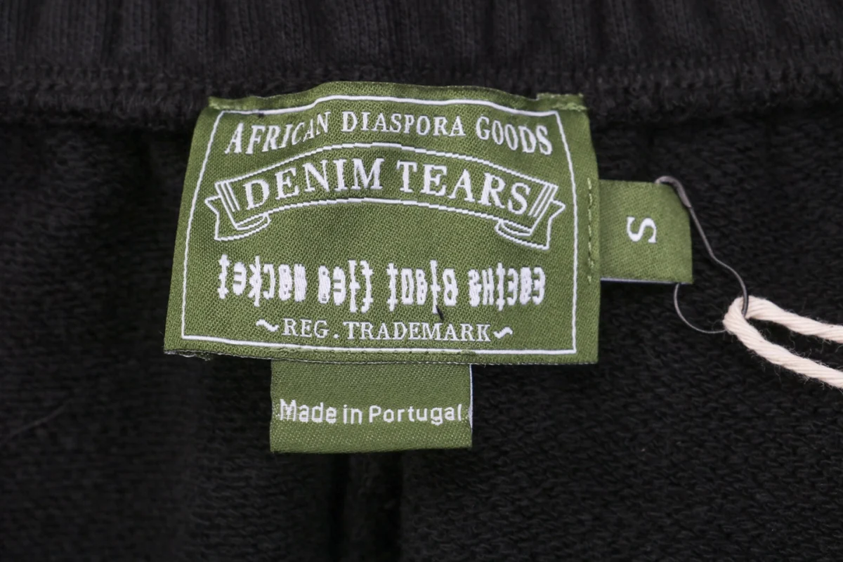 Denim Tears logo tag