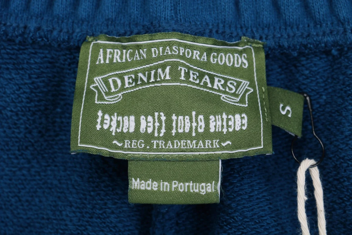 Denim Tears logo tag