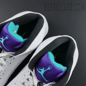 Air Jordan 5 Retro ‘Grape’ 2025 sneaker tongue close-up with purple and teal Jumpman logo