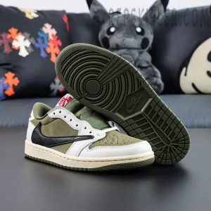 Outsole view of the Travis Scott Air Jordan 1 Low Reverse Olive showing olive rubber traction pattern.