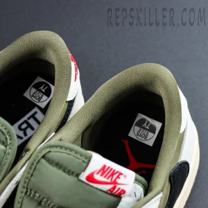 Close-up of the inner lining and insole branding on the Travis Scott x Air Jordan 1 Low Reverse Olive.