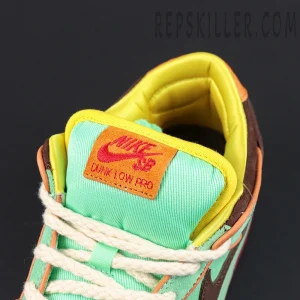 Close-up of the tongue label on Nike Dunk Low SB ‘Rodeo’ featuring orange patch and red Nike SB logo