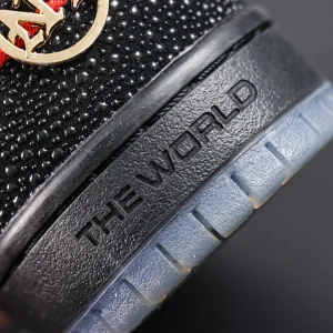 Close-up of Bronx Girls Skate x Nike Dunk Low SB ‘Mel & Kava’ heel with gold NYC emblem and embossed “THE WORLD” text on black midsole