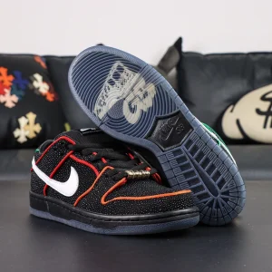 Pair of Bronx Girls Skate x Nike Dunk Low SB ‘Mel & Kava’ with one shoe flipped to show icy blue outsole featuring translucent BXGS graphic