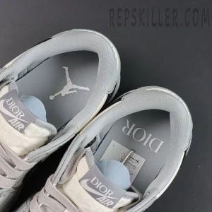 Dior x Air Jordan 1 Low sneakers top view showcasing Dior Air tongue tag and Jumpman logo insoles