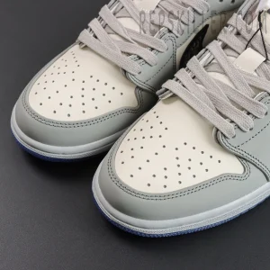 Dior x Air Jordan 1 Low close-up of perforated leather toe box and flat grey laces