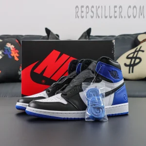 Front angled display of Fragment Design x Air Jordan 1 Retro High OG with extra blue shoelaces and Nike box in background