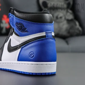Back heel view of Fragment Design x Air Jordan 1 Retro High OG highlighting stitched heel panel and lightning logo