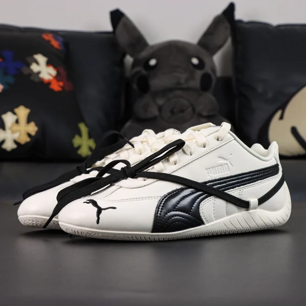 Rosé x Wmns Speedcat Premium ‘Warm White’ side view showing white upper with black Formstrip and cross-lace detail