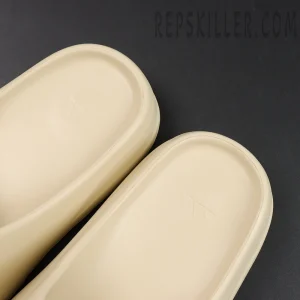 Inner footbed embossed adidas logo of the Yeezy Slides ‘Bone’