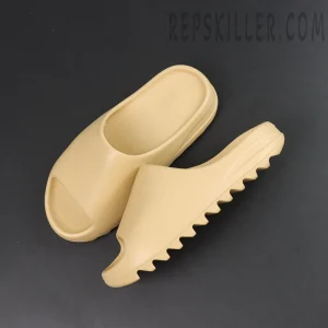 Yeezy Slides ‘Desert Sand’ Top & Side View Shows the soft Desert Sand tone with a minimal one-piece shape and serrated outsole.