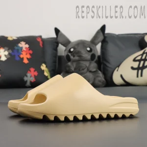 Yeezy Slides ‘Desert Sand’ Side Profile Reveals the sleek curved upper and thick sole with bold serrated edges.