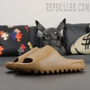Top-down perspective of the adidas Yeezy Slides ‘Soot’ showing overall silhouette and arch.