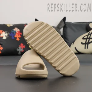 Outsole view of Yeezy Slides ‘Pure’ 2021 Re-Release with box setup