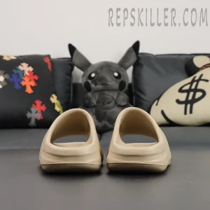 Back view of Yeezy Slides ‘Pure’ 2021 Re-Release placed side by side