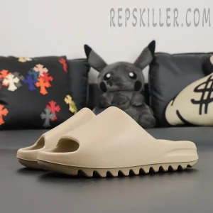Angled perspective of Yeezy Slides ‘Pure’ 2021 Re-Release pair