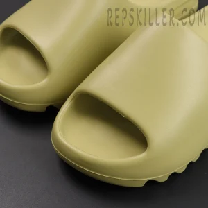 Yeezy Slides ‘Resin’ front view revealing wide strap upper and open toe