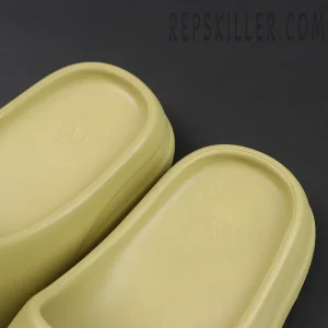 Yeezy Slides ‘Resin’ insole featuring subtle adidas three-stripe logo