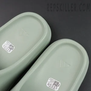 Close-up of insole branding on Yeezy Slides ‘Salt’ with embedded adidas logo.