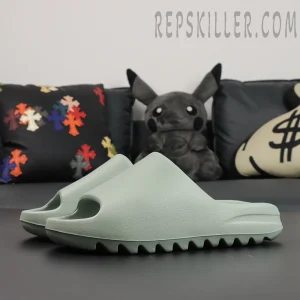 Angled view of Yeezy Slides ‘Salt’ showing full profile and rugged sole.