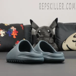 Back heel view of the Yeezy Slides ‘Slate Marine’ revealing the smooth rear profile.