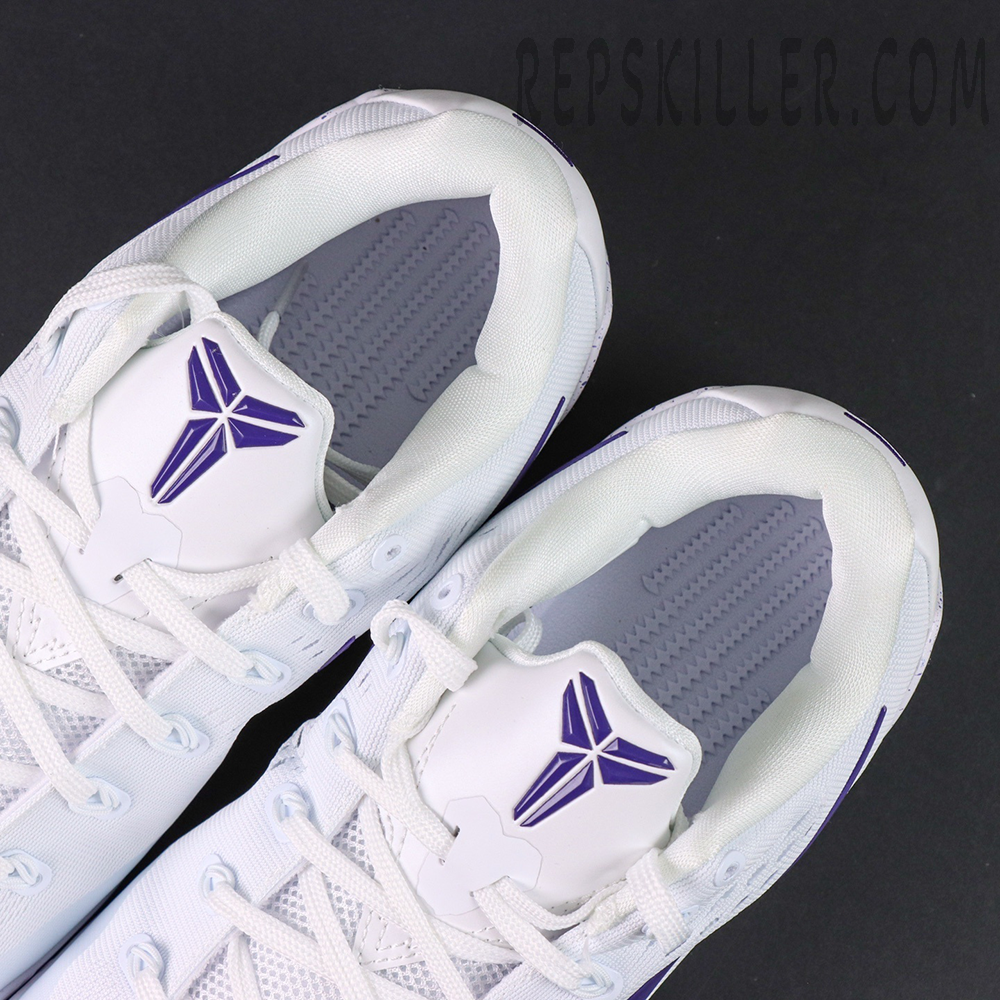 Nike Kobe 9 EM Protro TB ‘Lakers Home’ — Top view showcasing the dual Kobe logos on the white tongue with purple accents.