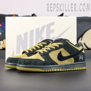 Nike Supreme x Dunk Low SB “Camper Green” angled front view displaying the signature color contrast and Supreme midsole text.