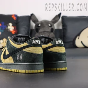 Nike Supreme x Dunk Low SB “Camper Green” rear view showing embroidered 94 logo and NIKE heel branding over green suede.