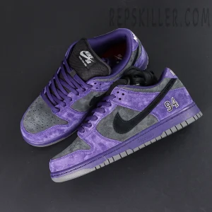 Nike Supreme x Dunk Low SB “Ink” angled top view showing premium suede material and Supreme logo detail on midsole.