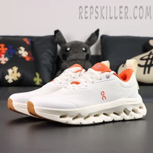 ON Loewe x Cloudtilt 2 ‘White Orange’ angled pair view highlighting layered mesh and orange detailing.