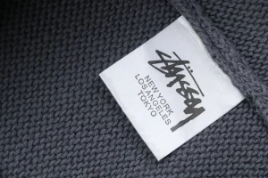Stussy Surfer Graphic Knit Sweater Wash tag
