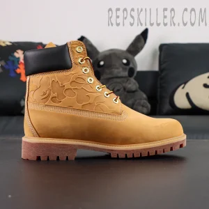 A Bathing Ape x Undefeated x Timberland 6 Inch “Wheat” close-up side profile showing embossed camo pattern and brown rubber outsole.