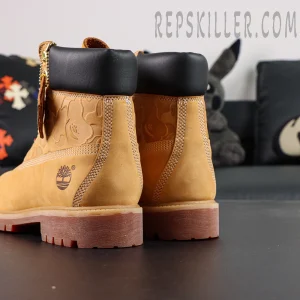 Rear view of A Bathing Ape x Undefeated x Timberland 6 Inch “Wheat” highlighting padded black collar and double-stitched heel.