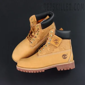 Top-down view of A Bathing Ape x Undefeated x Timberland 6 Inch “Wheat” featuring rope laces and embossed leather pattern.