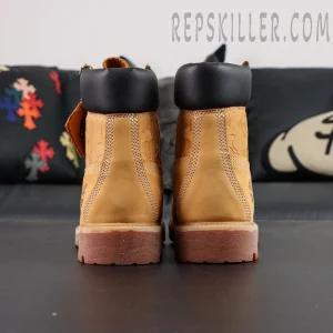 Back view of A Bathing Ape x Undefeated x Timberland 6 Inch “Wheat” emphasizing rugged sole and classic work boot silhouette.