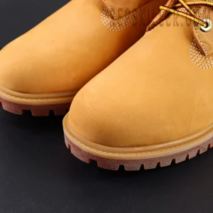 Close-up of A Bathing Ape x Undefeated x Timberland 6 Inch “Wheat” toe box showing smooth wheat nubuck grain.
