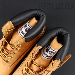 Inner collar view of A Bathing Ape x Undefeated x Timberland 6 Inch “Wheat” featuring black padding and BAPE × Timberland co-branded label.