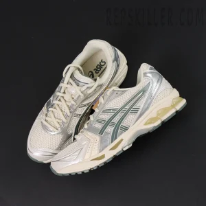 ASICS GEL-Kayano 14 “Birch Dark Pewter” pair flat lay showing metallic silver and cream mesh details.