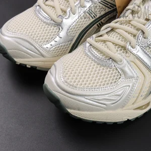 Close-up of ASICS GEL-Kayano 14 “Birch Dark Pewter” toe box showing mesh upper and synthetic overlays.