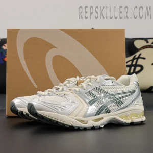 ASICS GEL-Kayano 14 “Birch Dark Pewter” pair with box in background showing beige and silver color scheme.
