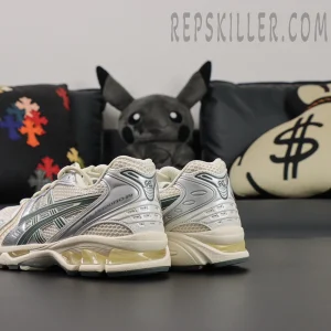 Rear view of ASICS GEL-Kayano 14 “Birch Dark Pewter” showing heel GEL cushioning and metallic overlays.