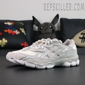 Angled view of ASICS GEL-NYC “Cream Cloud Grey” pair highlighting the sleek cream and grey colorway.