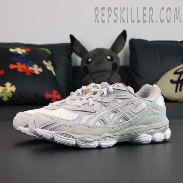 Angled view of ASICS GEL-NYC “Cream Cloud Grey” pair highlighting the sleek cream and grey colorway.