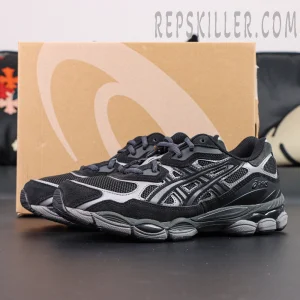 ASICS GEL-NYC “Graphite Grey Black” with box in background showing dark layered upper and grey midsole.