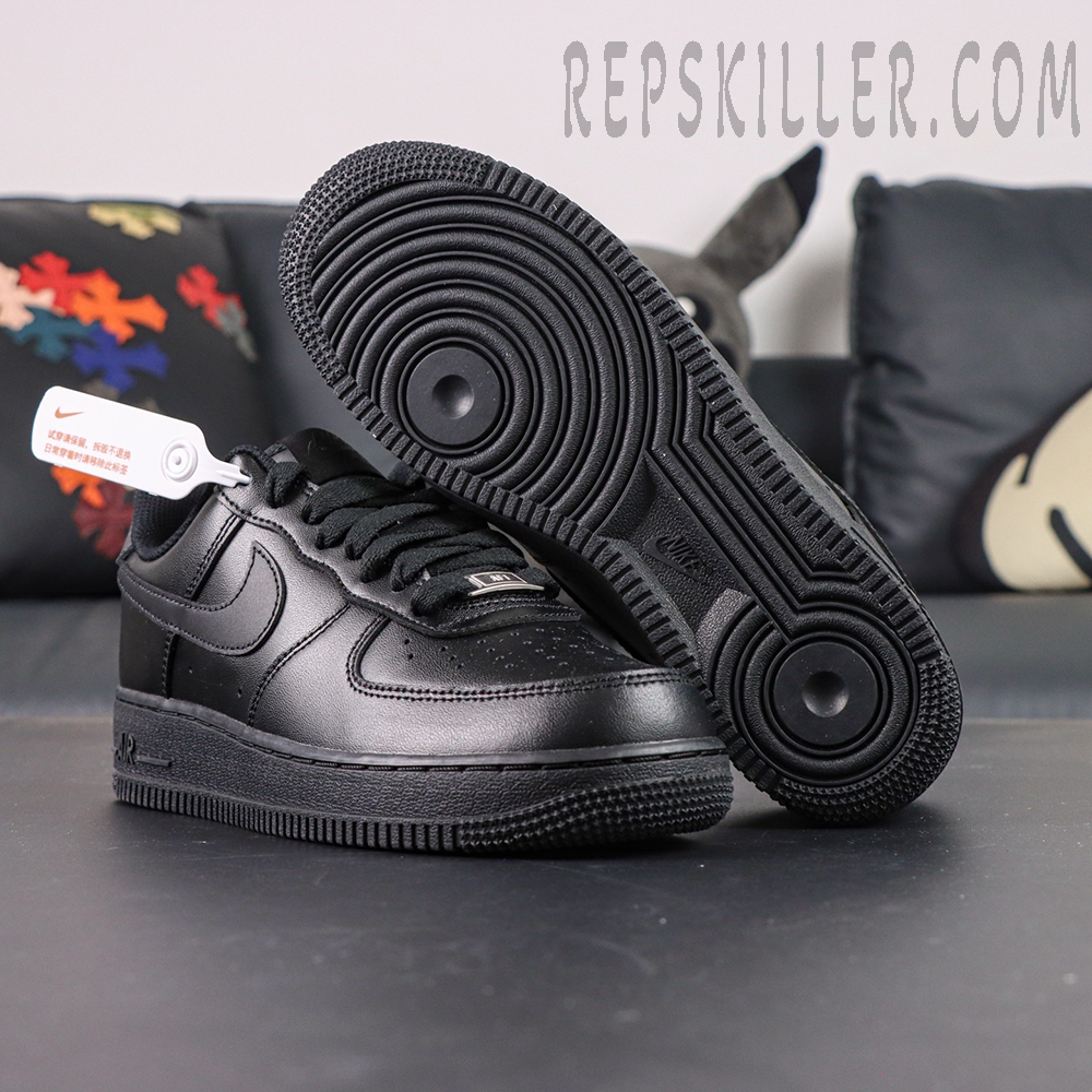 Nike Air Force 1 ’07 “Triple Black” outsole and side view showing classic circular traction pattern.